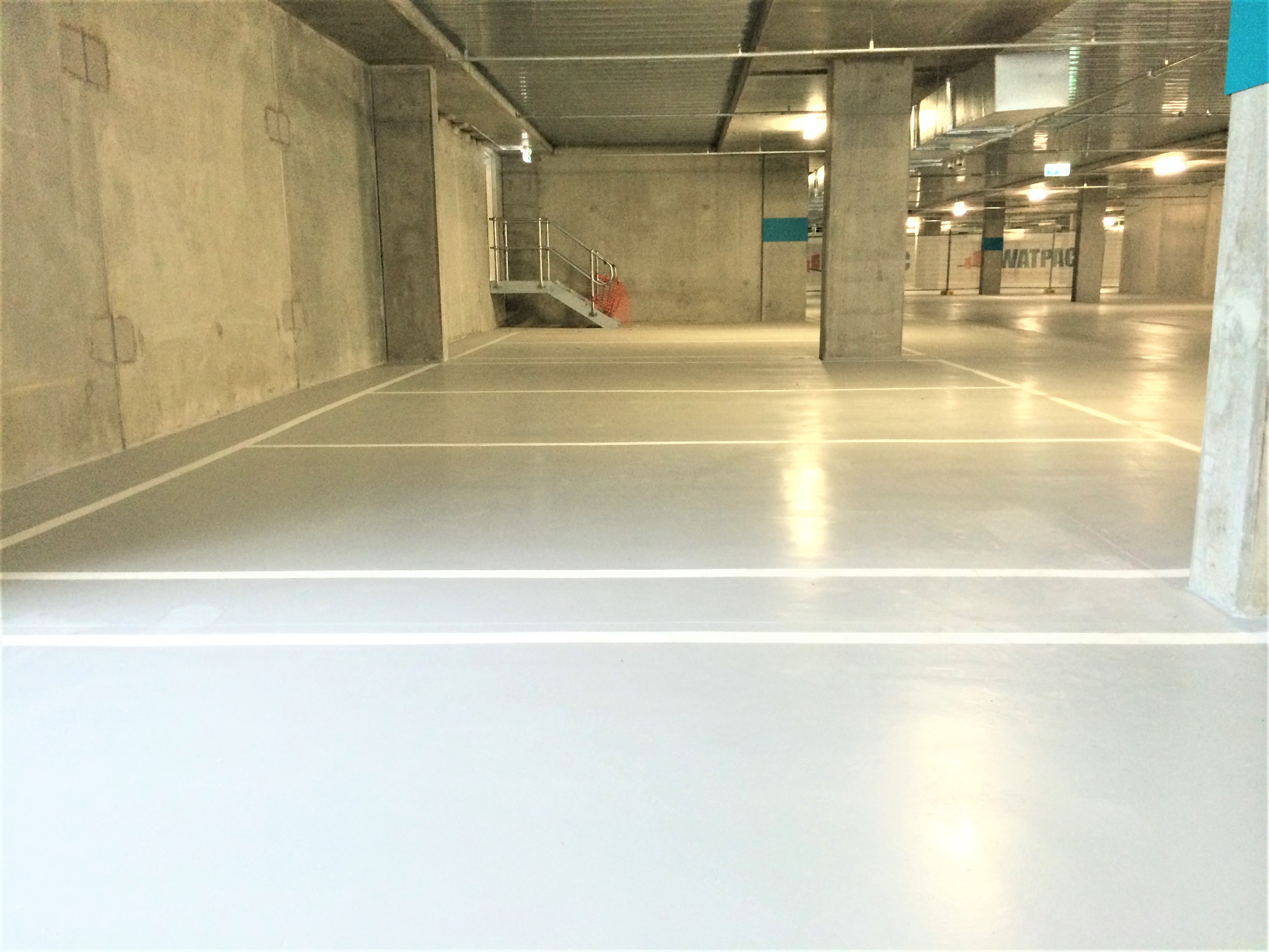 Aquepoxy® water-based epoxy floor coating in a multi-level car park serving a high-rise building.